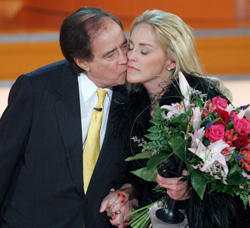 A picture of Cohn kissing Sharon Stone