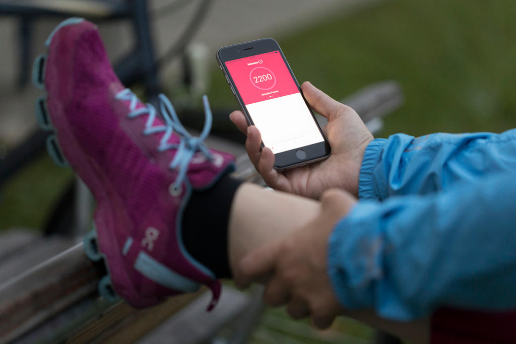 Person exercising holding a mobile phone