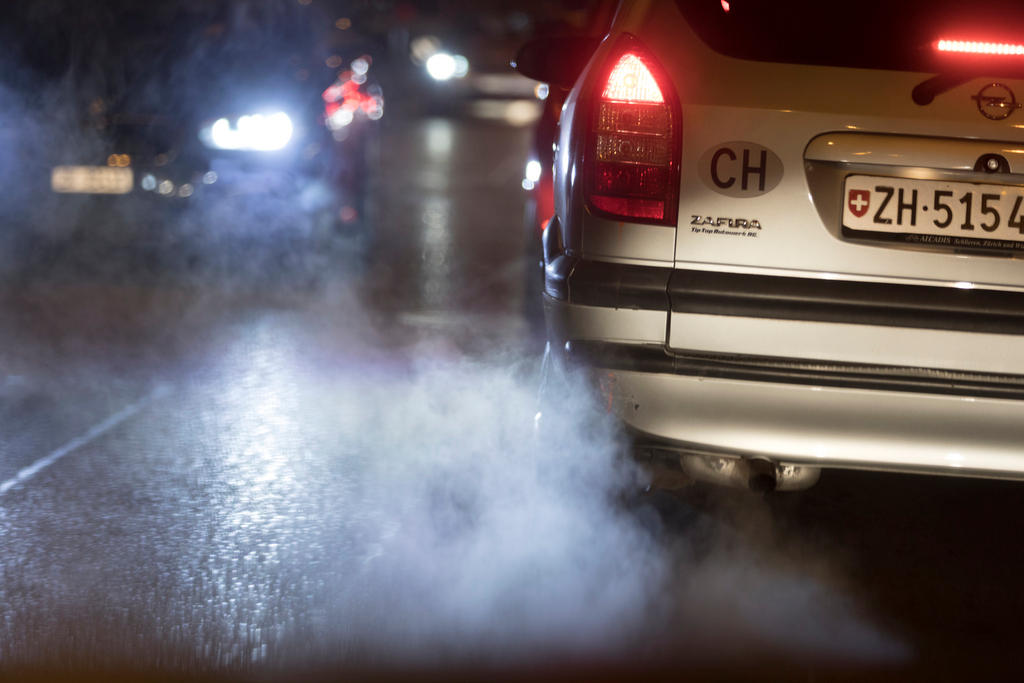 Exhaust fumes come out an Opel, pictured on a street in Zurich, Switzerland,