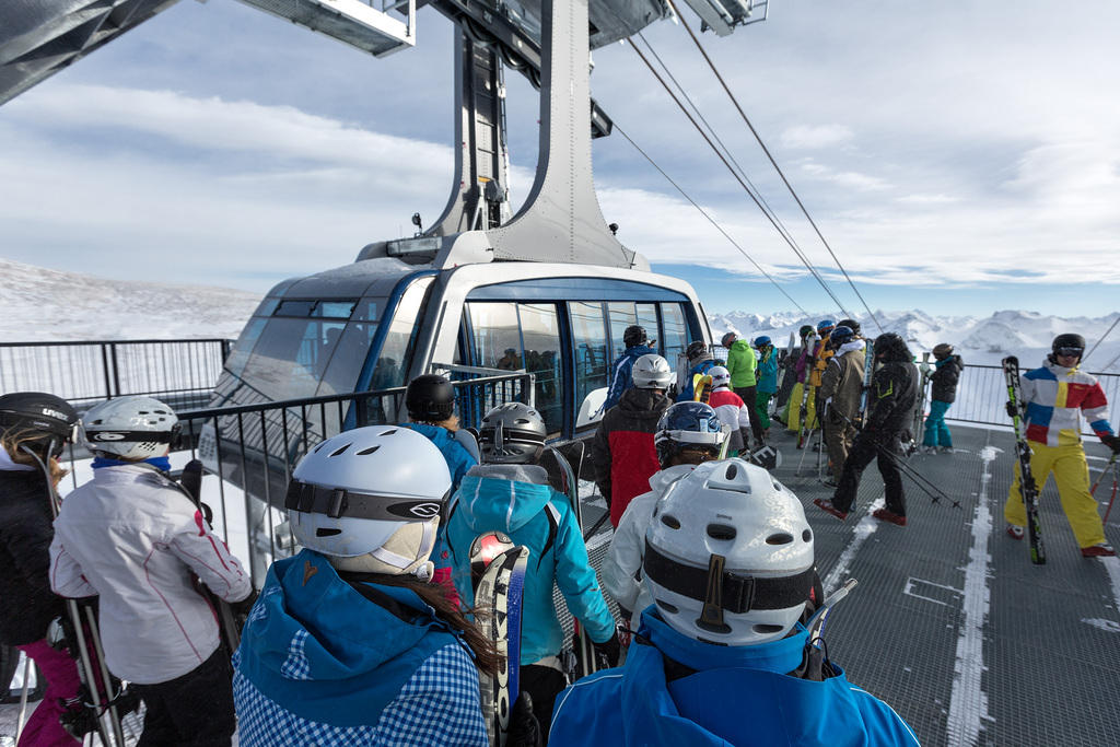 skiers on a chairlift