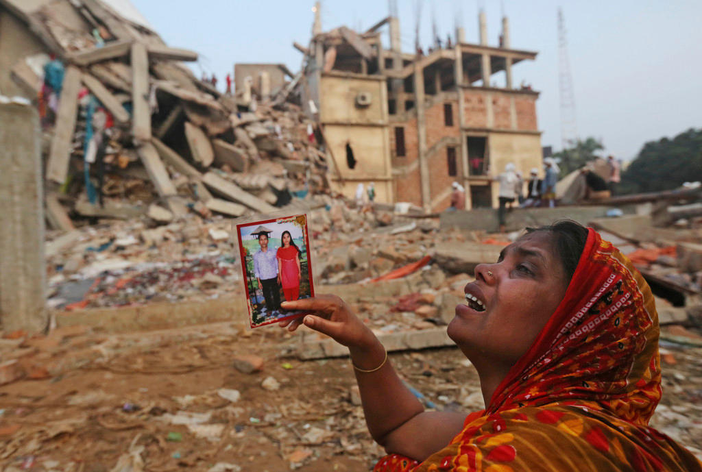 woman in front of wreckage