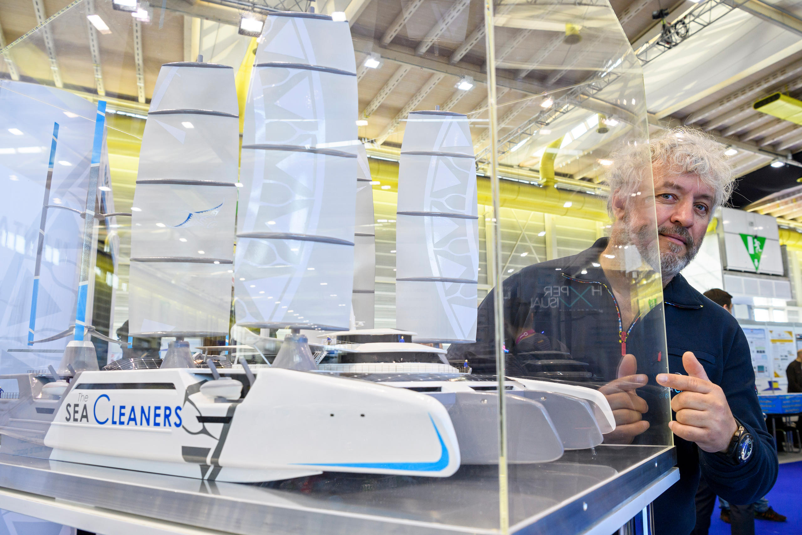 Yvan Bourgnon and a small scale model of a catamaran