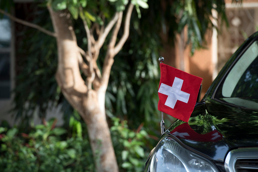 Car with Swiss flag
