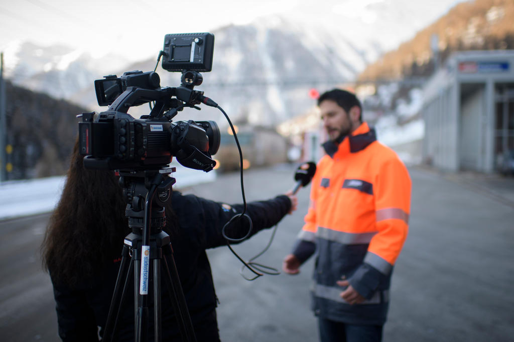 Journalist with microphone and camera