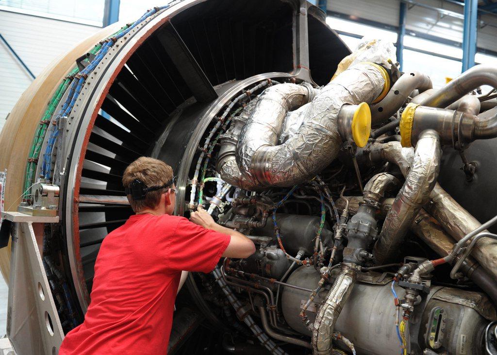 Engineer working at jet turbine