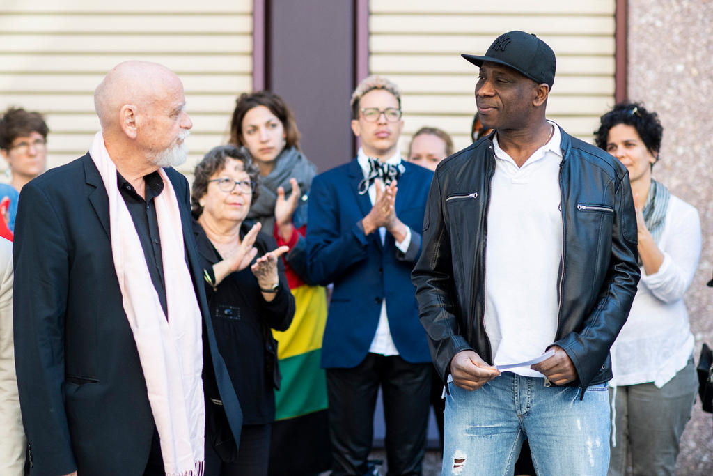 Plaintiff Wilson A. (right) next to his lawyer outside a Zurich court