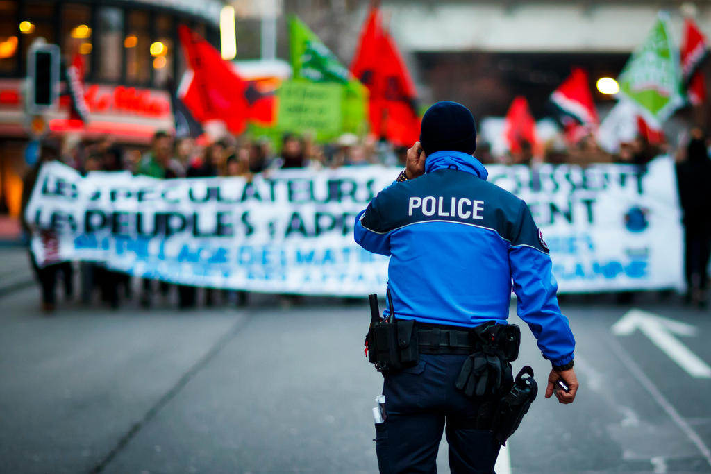 policeman facing crowd