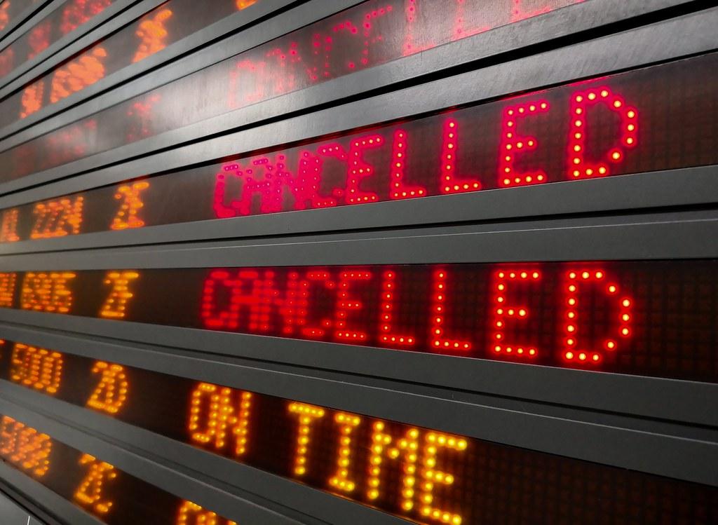 A picture of an information screen displaying cancelled flights.