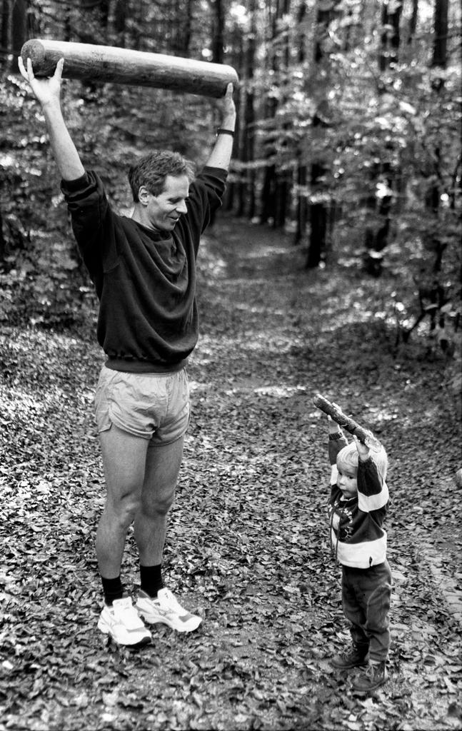 A father and his young son try out some exercises.