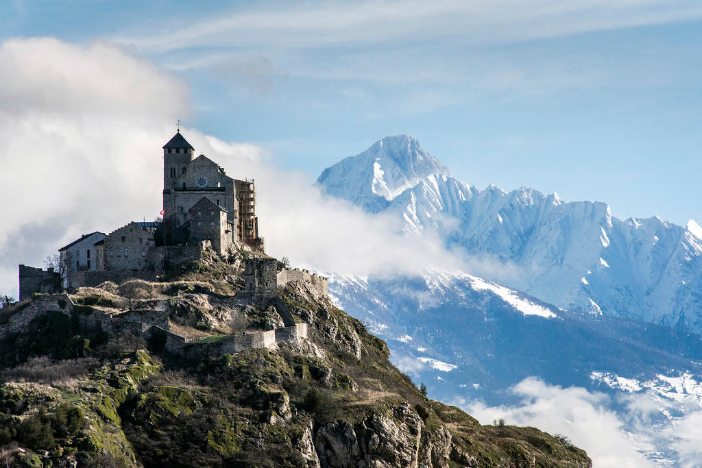 Sion castle with snowy Alps