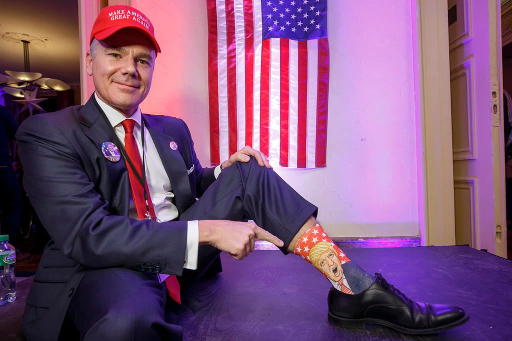 American citizen in Switzerland shows off socks featuring Donald Trump.