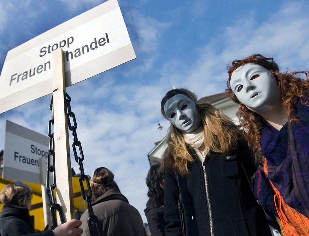A picture of a woman s march protest against human trafficking