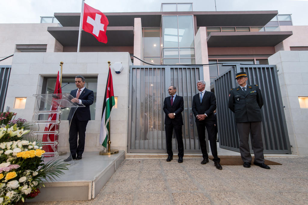 A picture of the inauguration ceremony in front of the embassy building