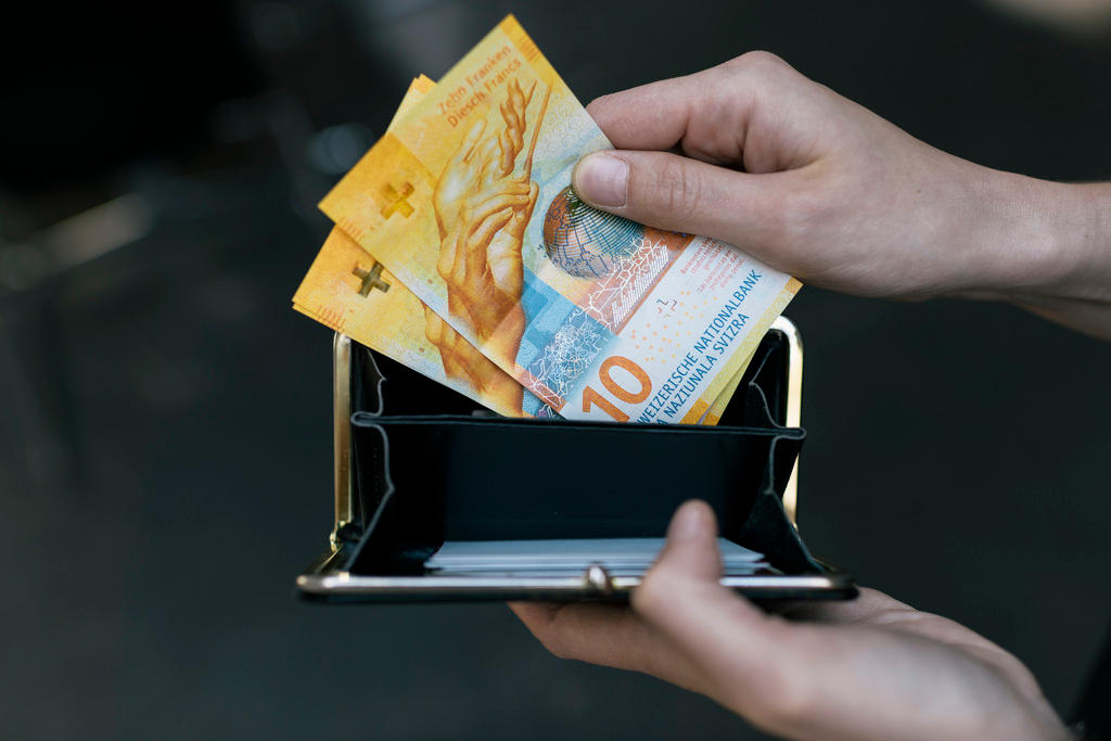 A wallet with Swiss francs