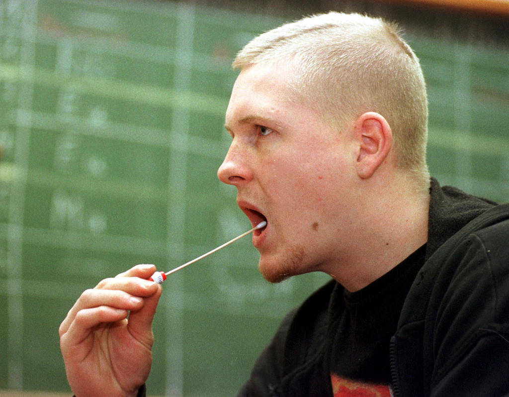 Man sticks swab in his mouth