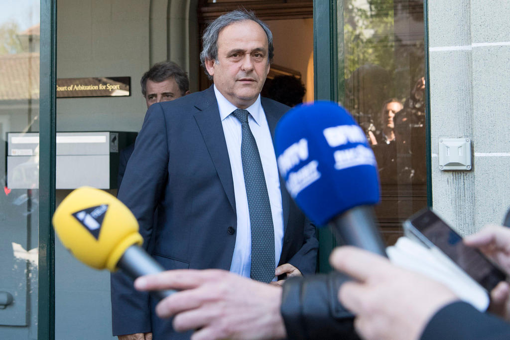 Michel Platini outside a court