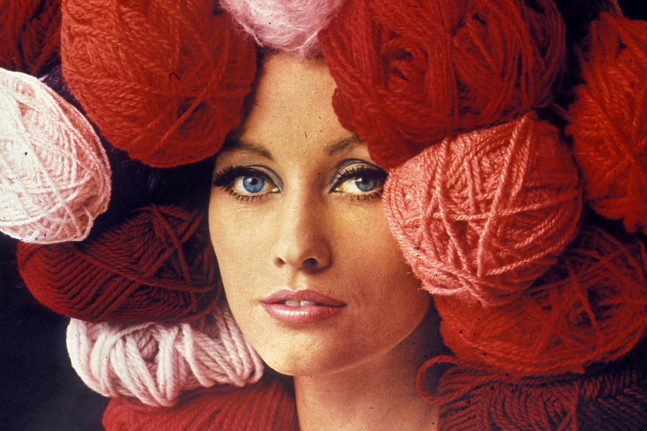 A woman wears a wool on her head