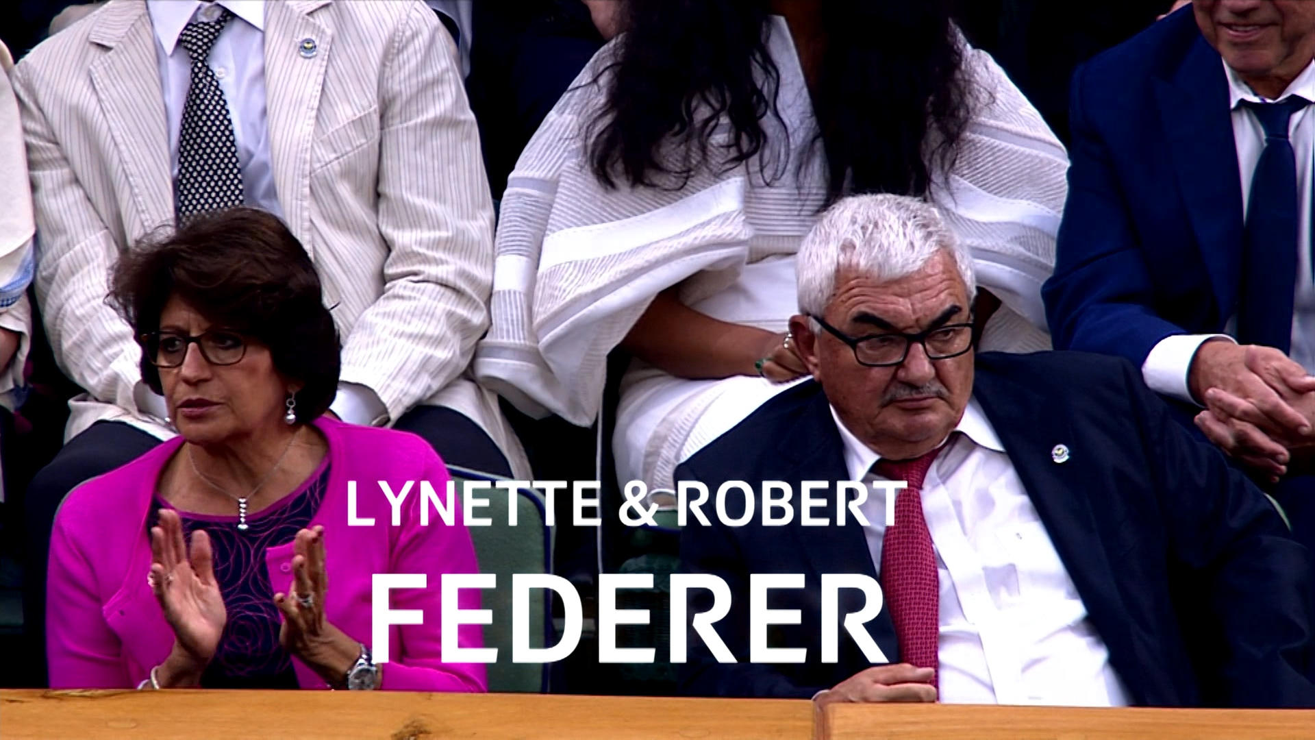 Lynette and Robert at tennis match wtching son