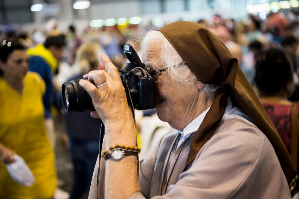 A nun with a camera
