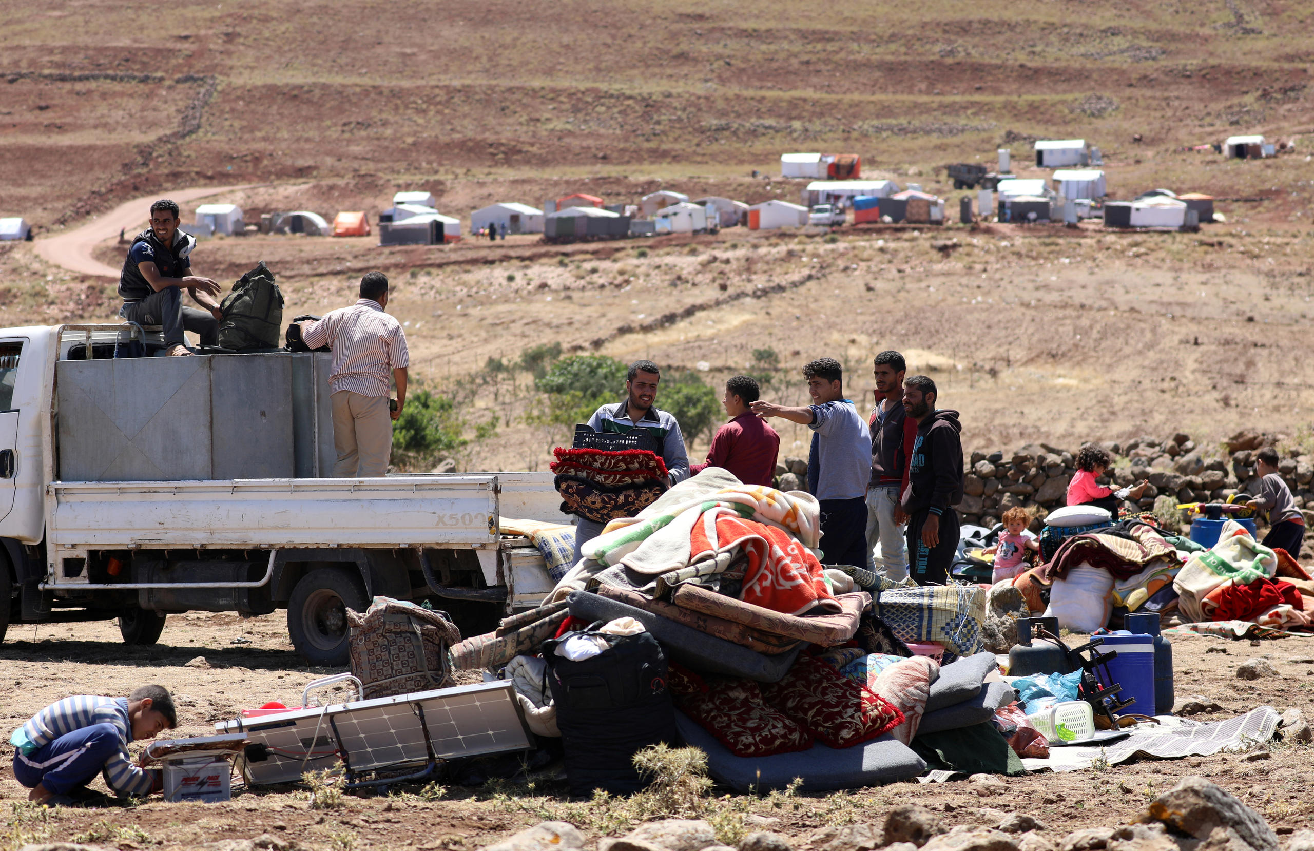 Syrian displaced people near the Israeli-occupied Golan Heights, in Quneitra, Syria, on June 21, 2018