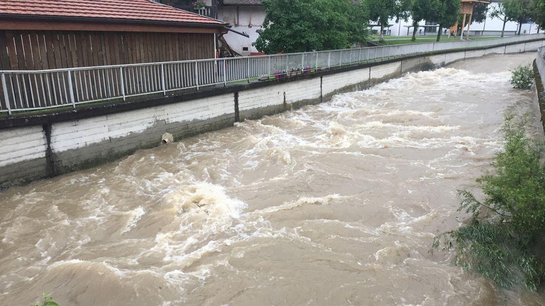 A river heavily swollen by rin