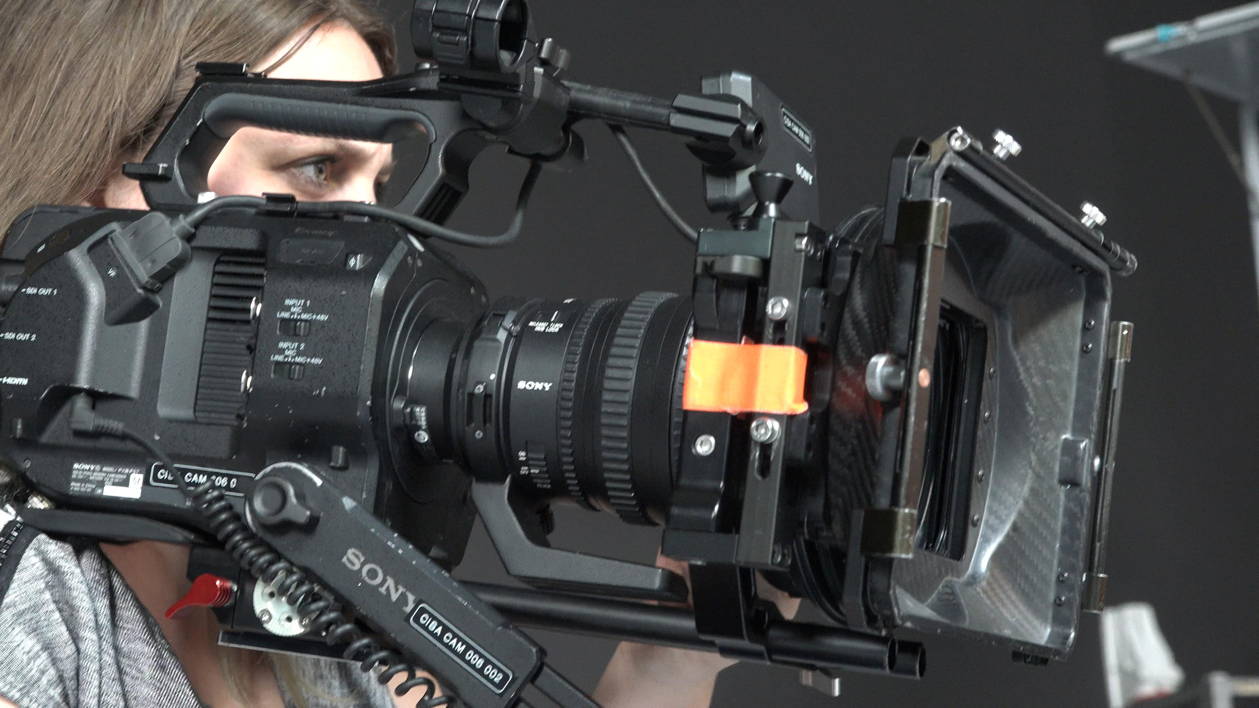 Student looking through camera