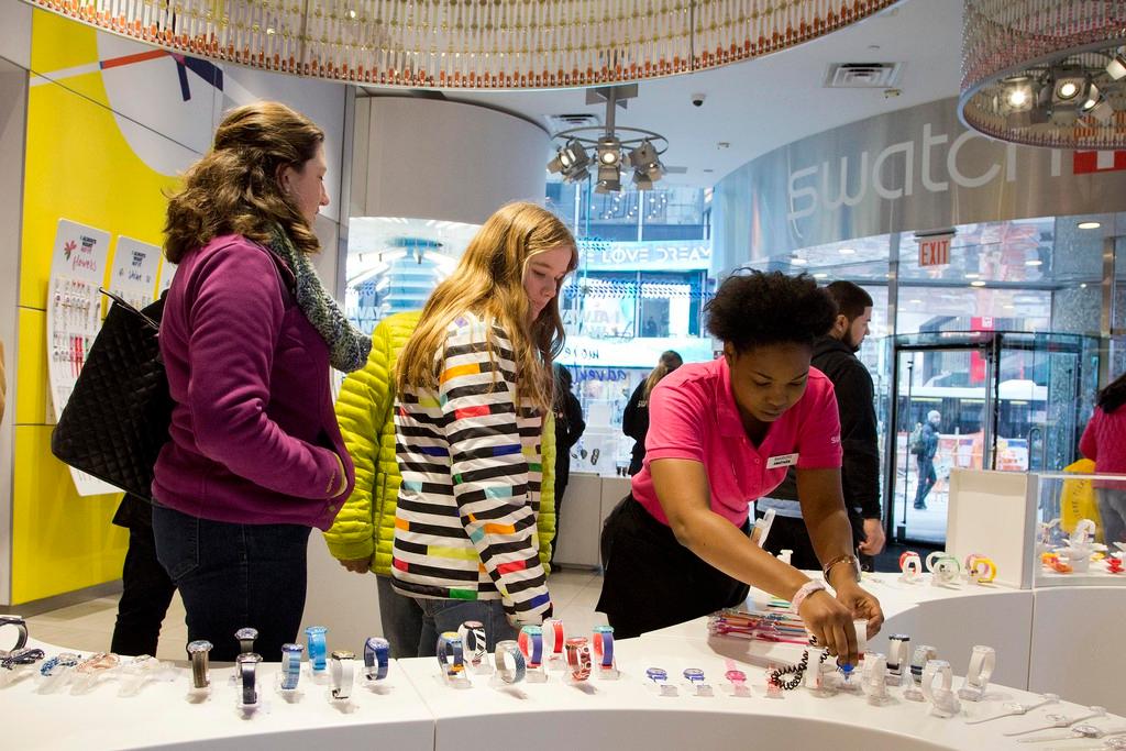 Customers in a Swatch shop