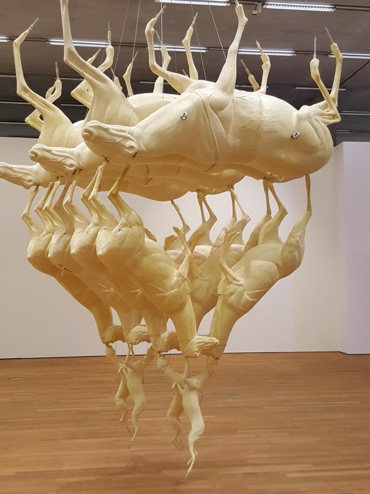 Leaping foxes installation, an upside-down taxidermy pyramid