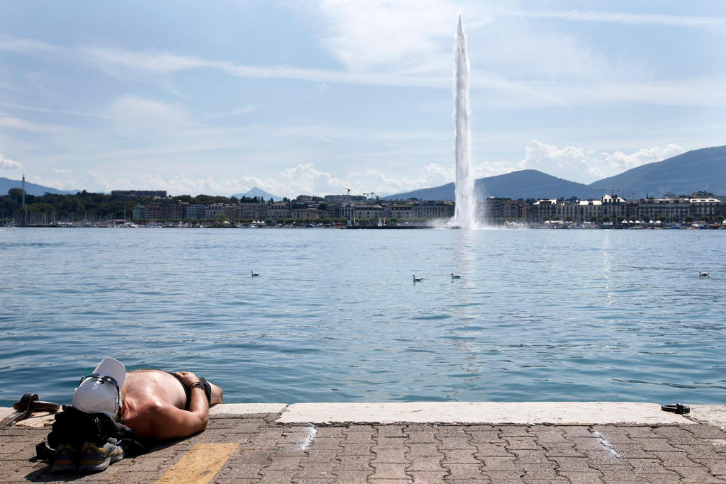 Sunbather by a lake