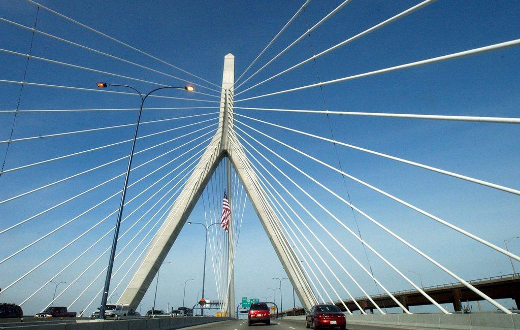 Traffic flows on both sides of a modern bridge.