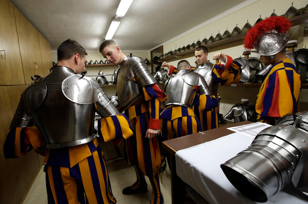 Swiss Guard troops put on their costumes and armour