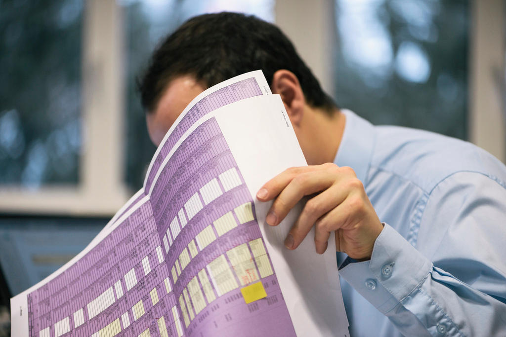 man behind an audit form