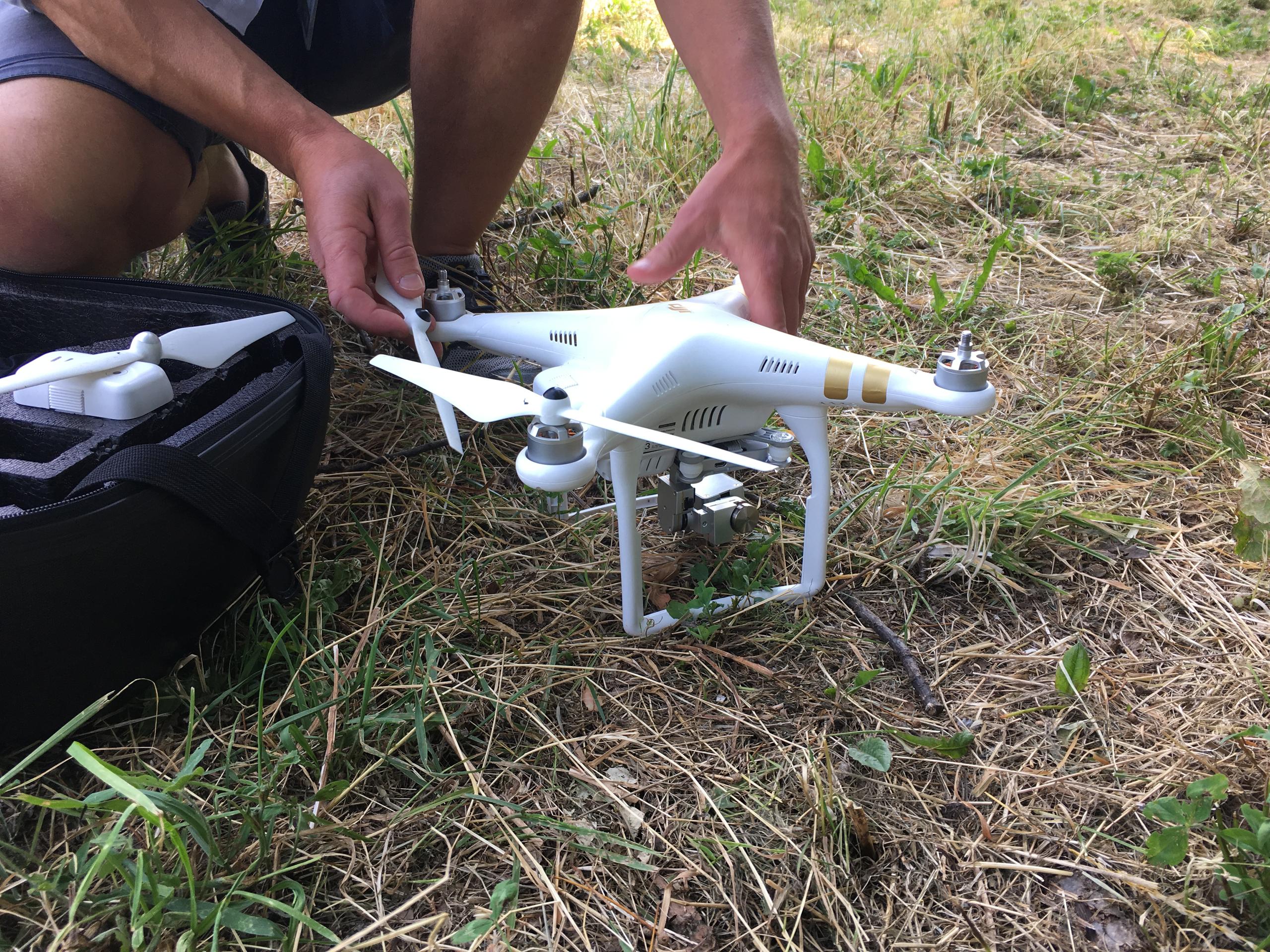 A man assembles a multi-rotor drone