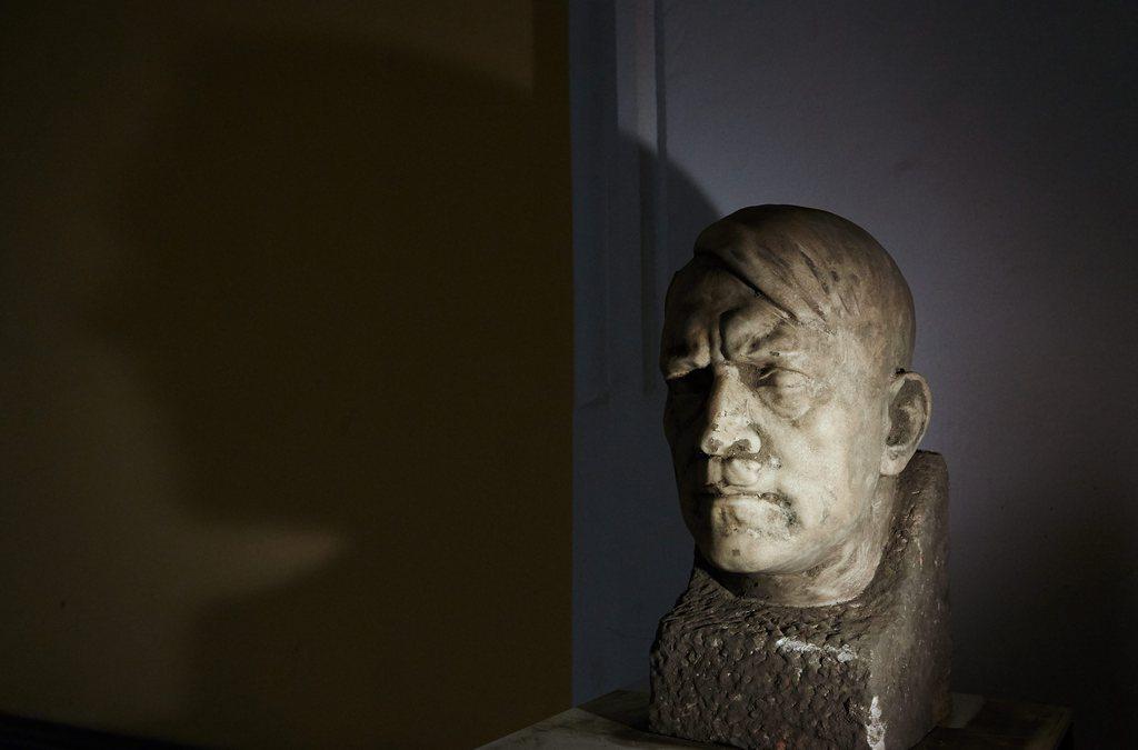 A picture of a Hitler bust in stone