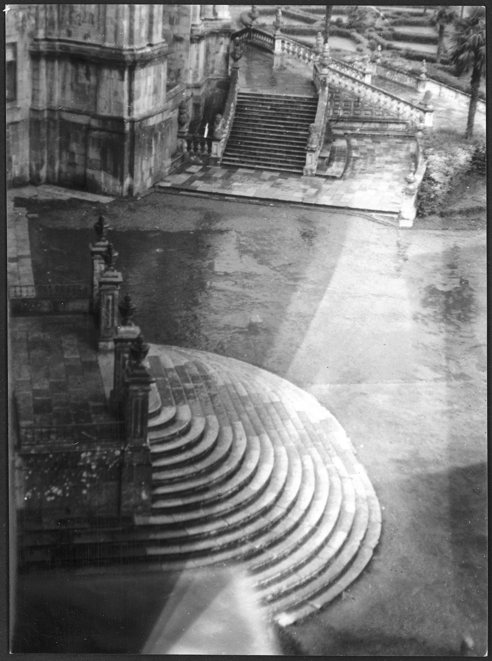 Black and white photo of steps to a courtyard