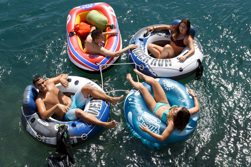 Boats and rubber rings on the River Rhône