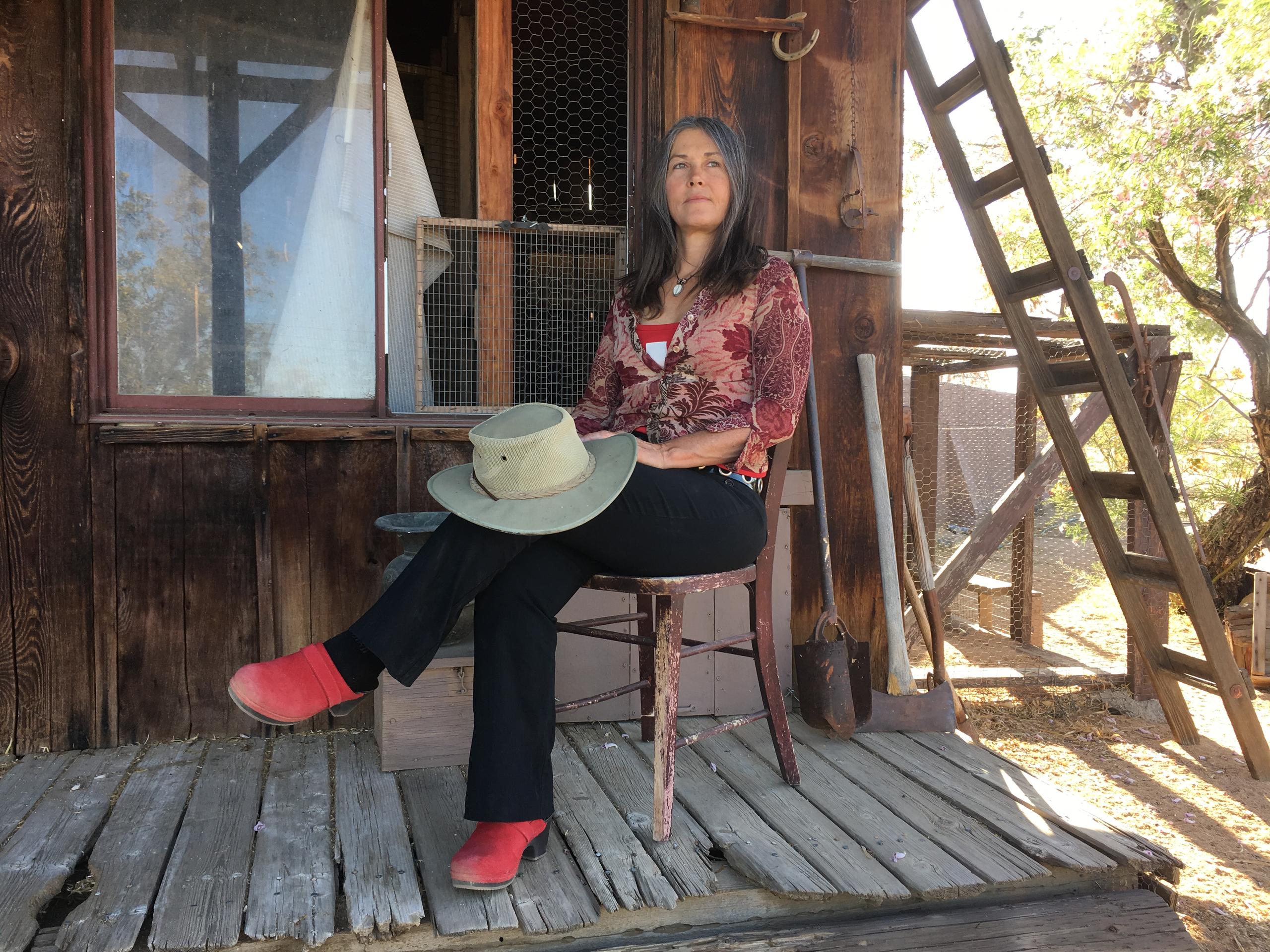 Claudia Bucher sitting on her porch