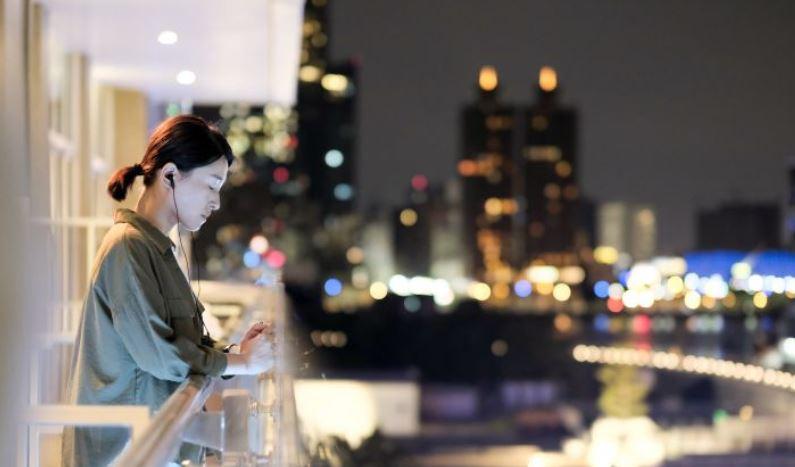woman on city balcony