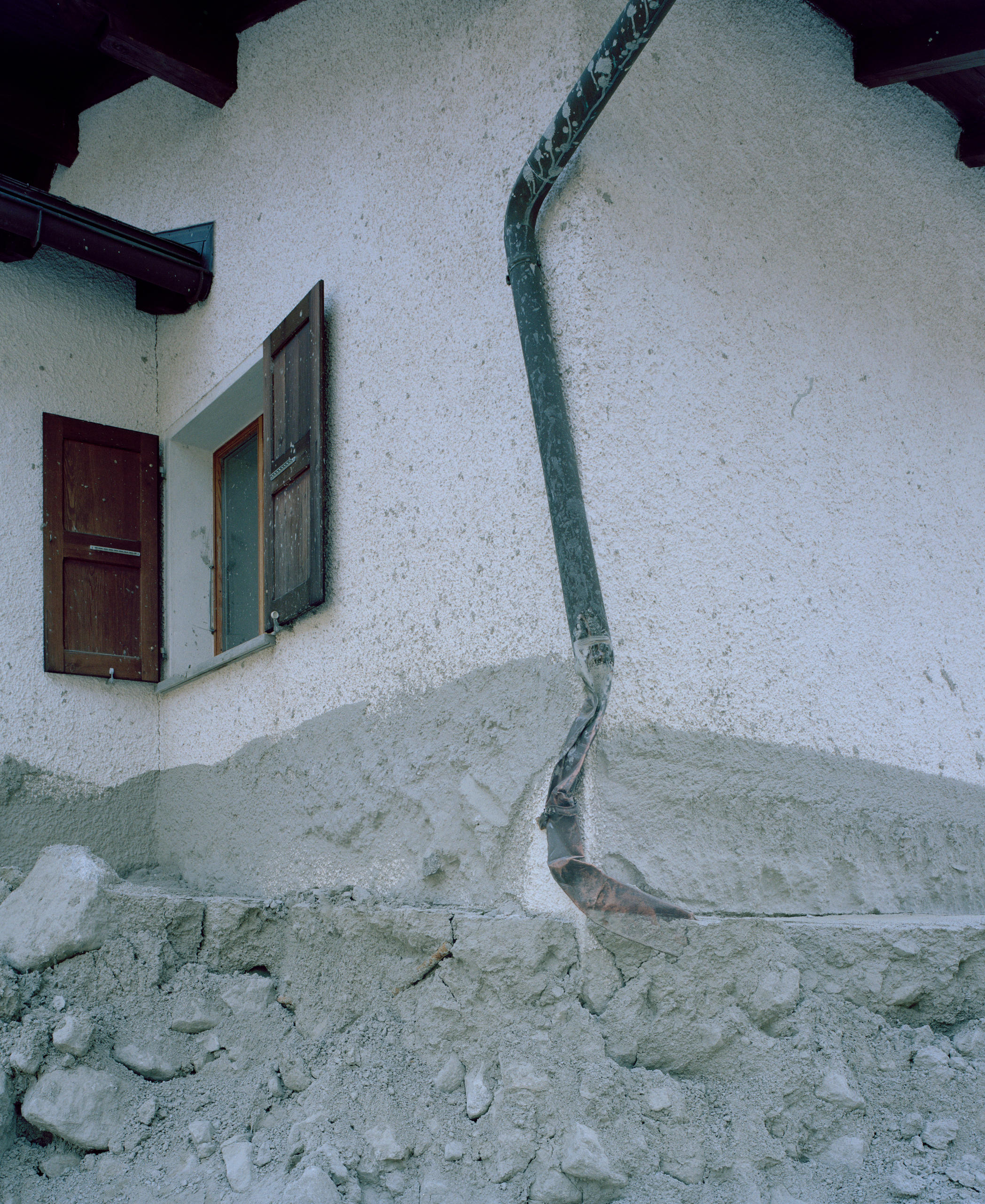 The damaged facade of a house