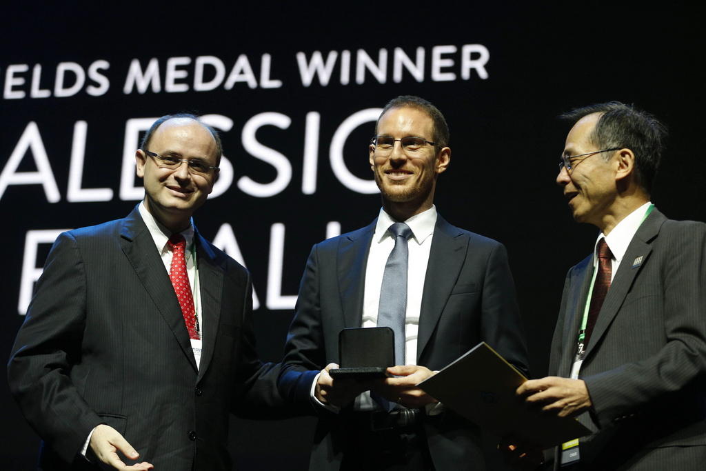 ETHZ professor Figalli (centre) receives Fields medal in Brazil