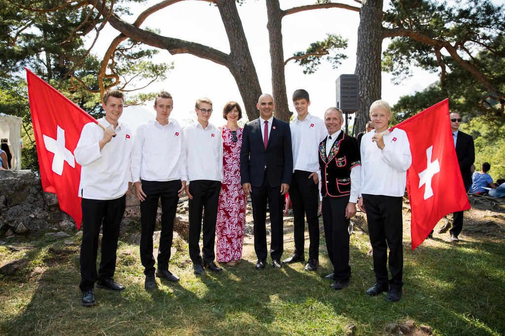 President Berset with wife and group of Swiss flag throwers on Rütli meadow