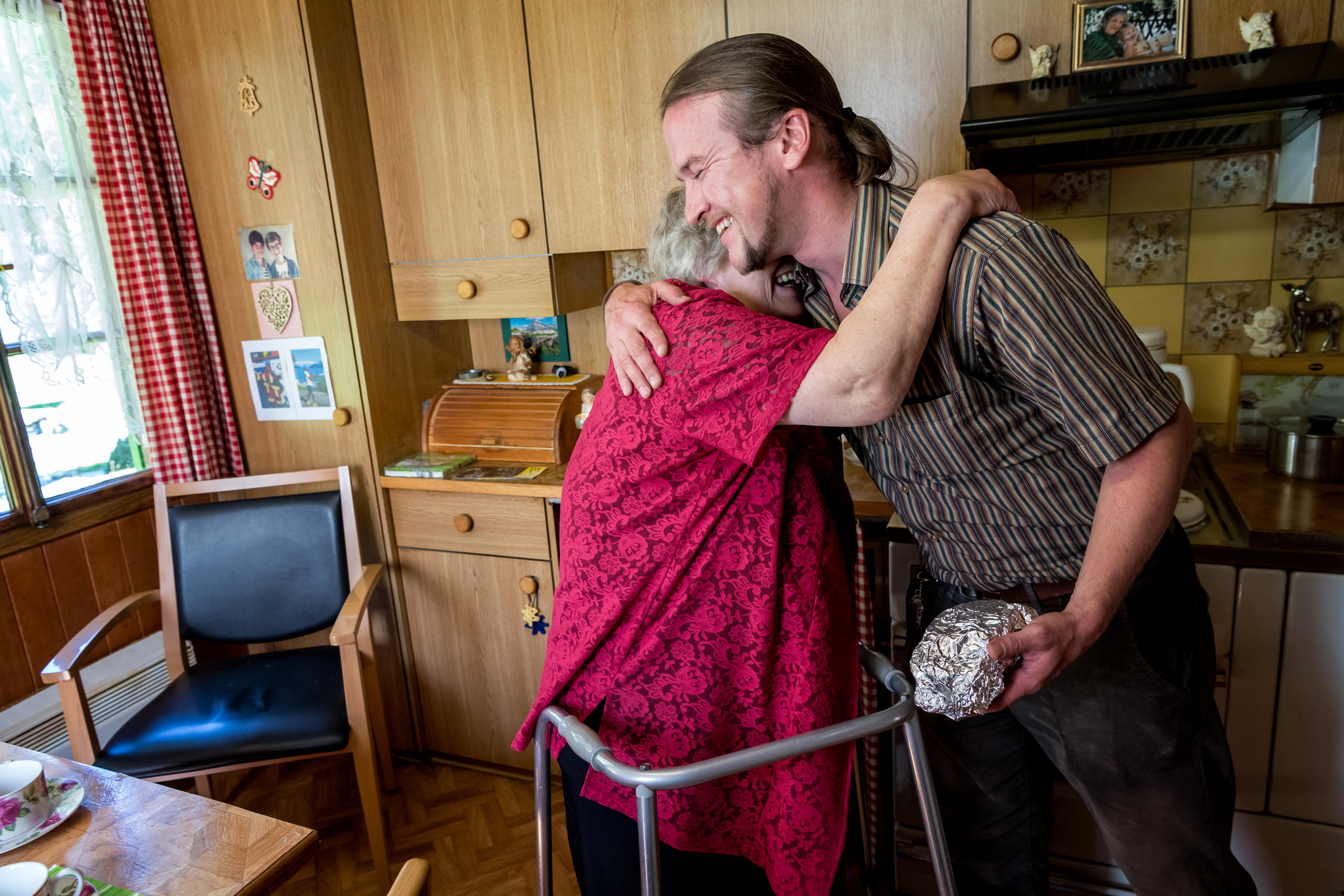 Woman puts her arms around dentist.