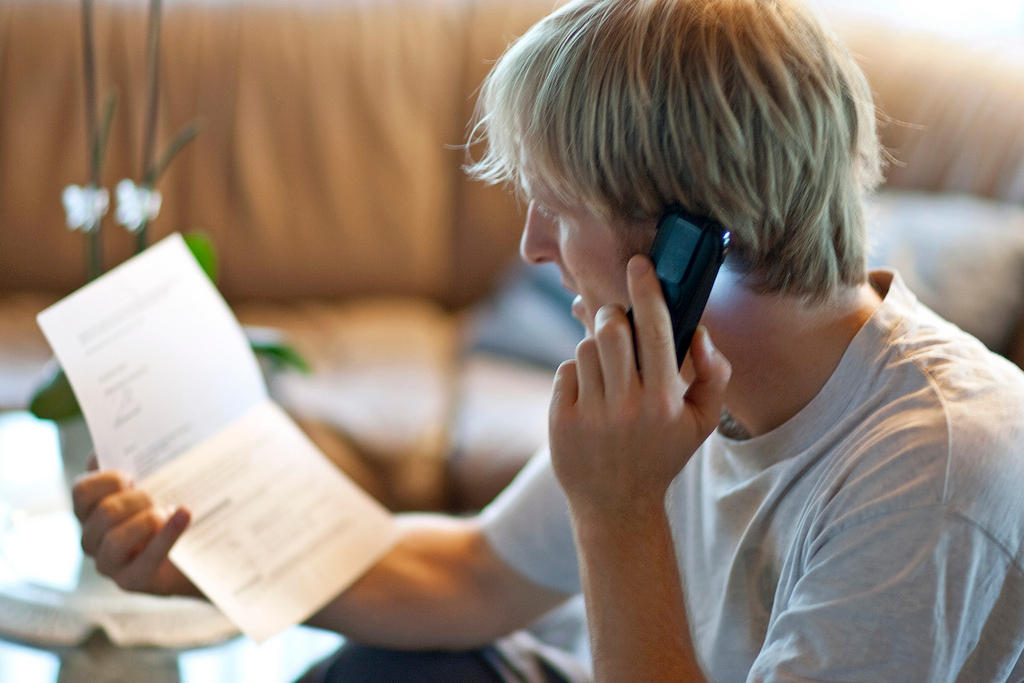 A job seeker talks on the phone to a possible employer