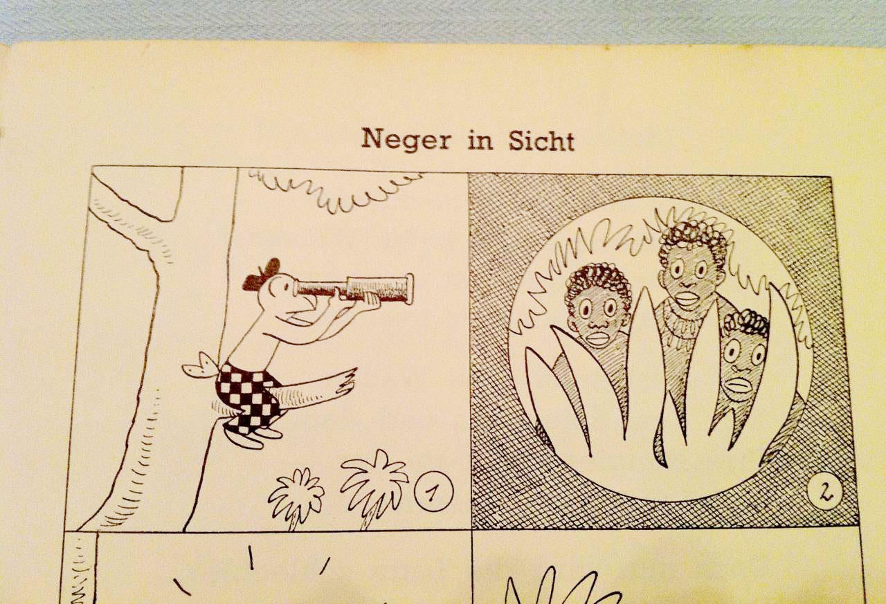 Comicstrip mit links Globi und rechts drei Afrikanern, die sich hinter einem Busch verstecken. Überschrift: Neger in Sicht