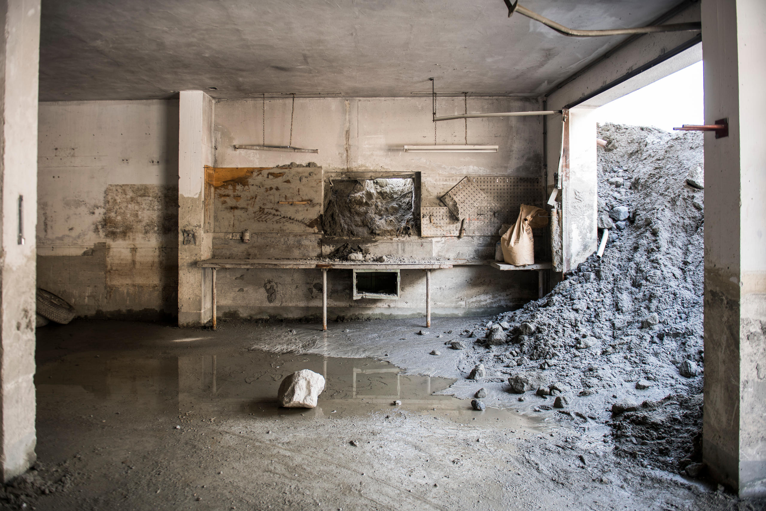 landslide flooding empty cellar room with earth