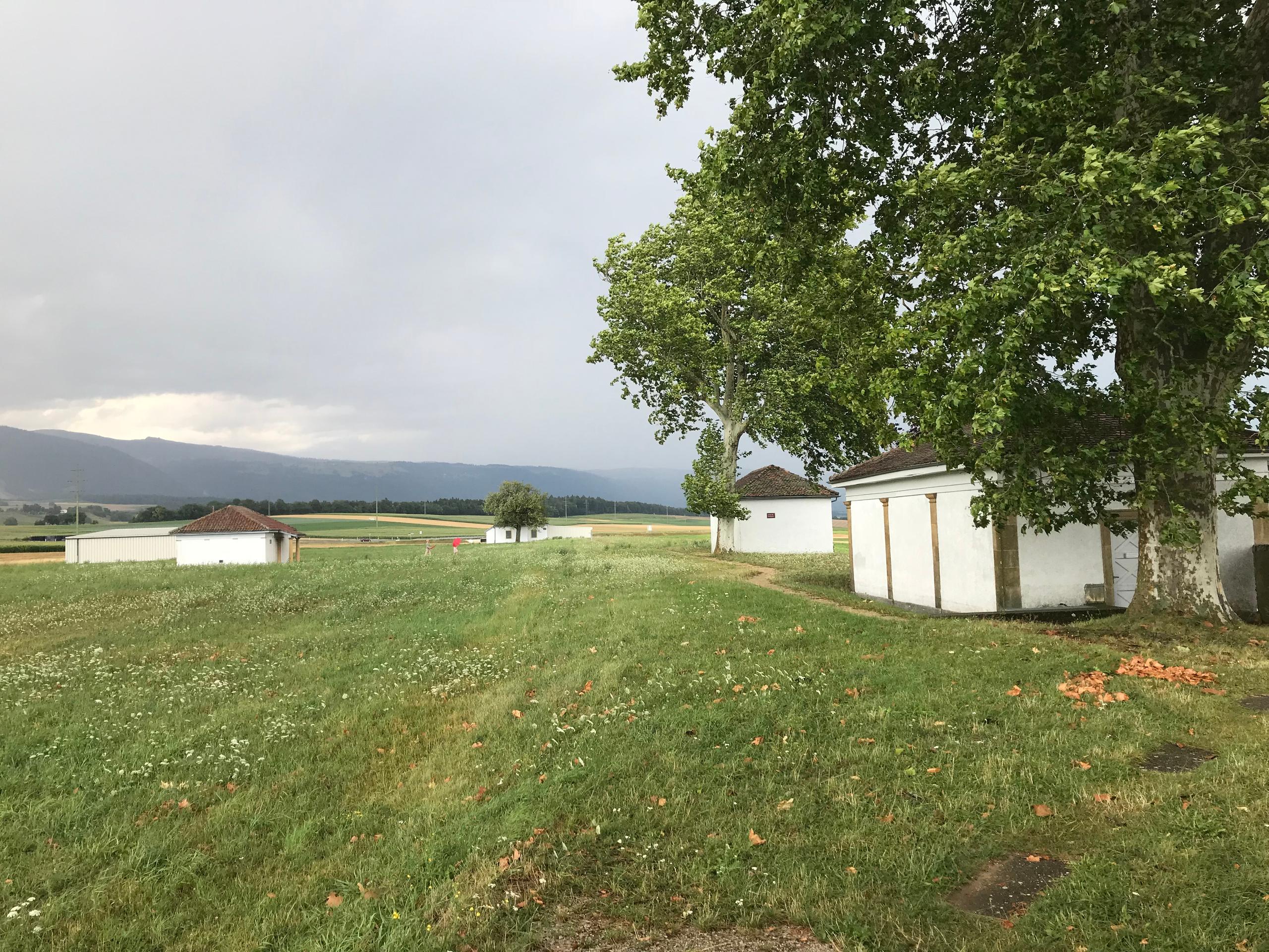 cement pavilions in a field