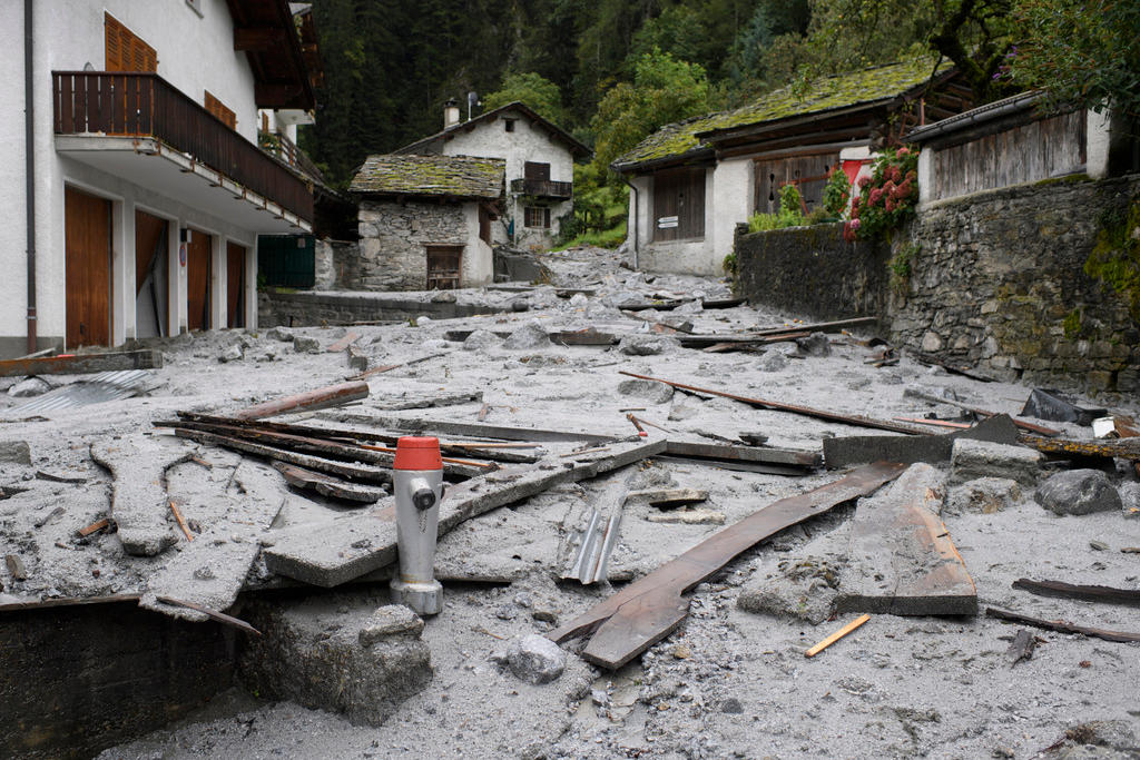 Destroyed road in the mountain village of Bondo