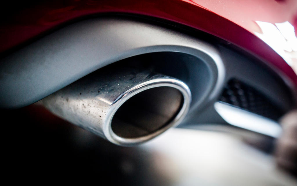 The exhaust pipe of an Audi A7 Sportback 3.0 TDI quattro, V6 diesel engine.