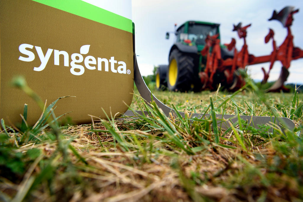 Tractor in a field behind the sign Syngenta