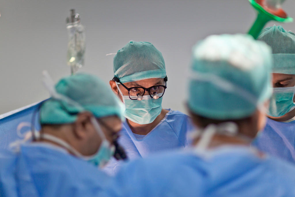 Physicians in an operating theatre